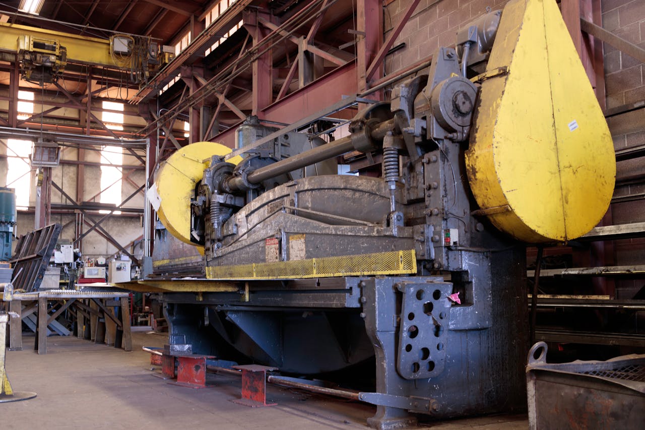 Heavy-duty industrial machine in a factory's production line, showcasing machinery details.